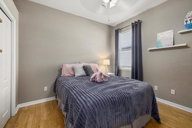 bedroom featuring wood-type flooring and ceiling fan