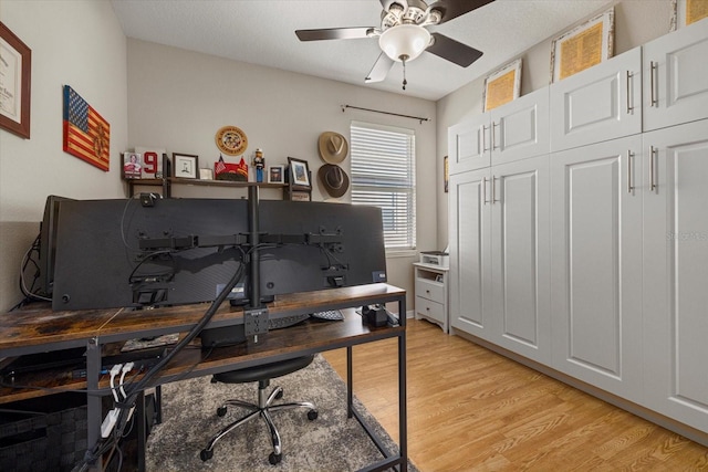 office with ceiling fan and light wood-type flooring