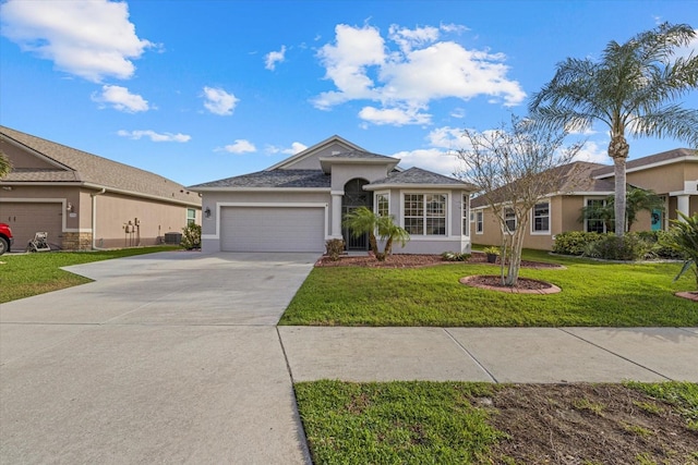 ranch-style home with a garage, central AC unit, and a front lawn