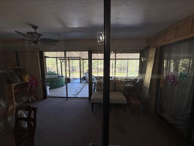 interior space featuring a ceiling fan