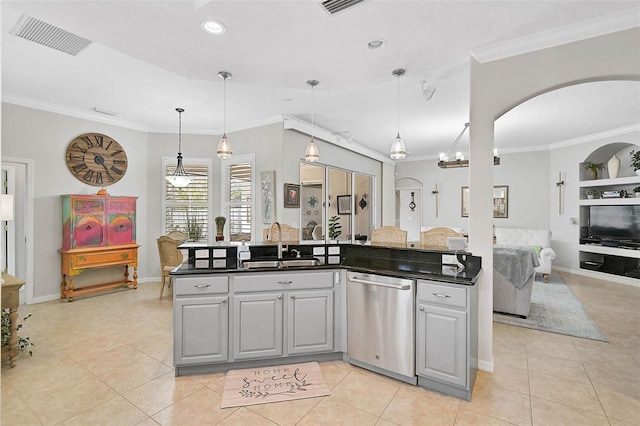 kitchen with pendant lighting, sink, gray cabinetry, ornamental molding, and stainless steel dishwasher