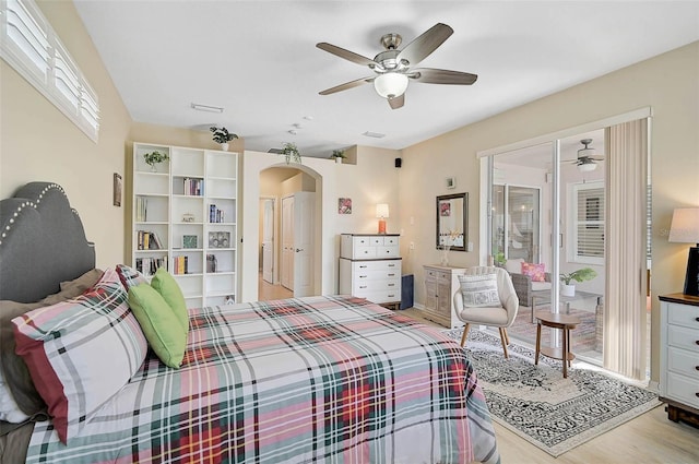 bedroom with ceiling fan, light hardwood / wood-style floors, and access to outside