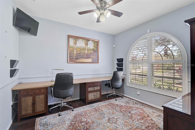 office with dark wood-type flooring and ceiling fan