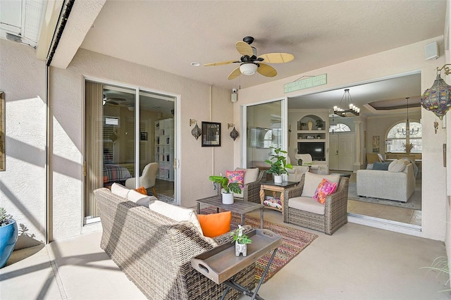 view of patio with outdoor lounge area and ceiling fan