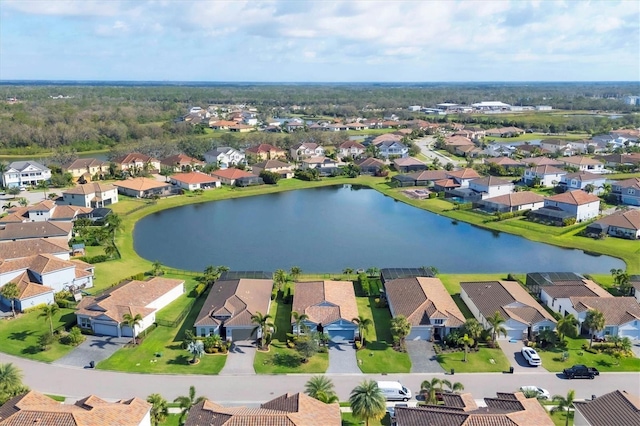 birds eye view of property with a water view and a residential view