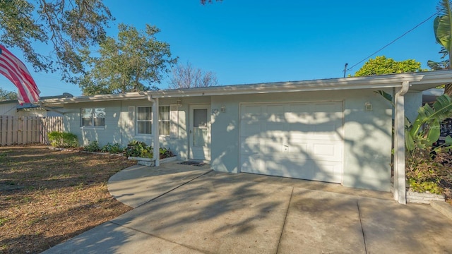 ranch-style home featuring a garage