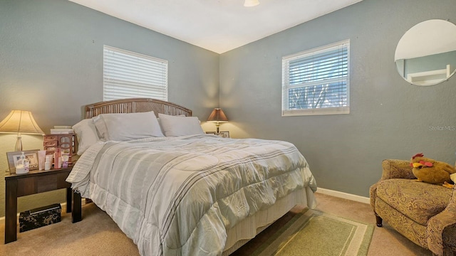 bedroom featuring light carpet