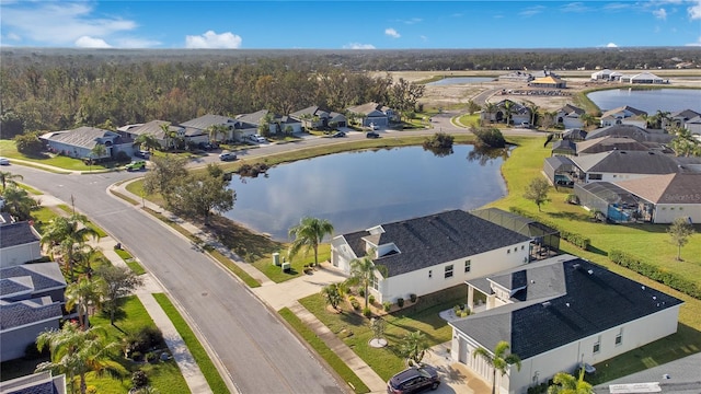 birds eye view of property with a residential view and a water view