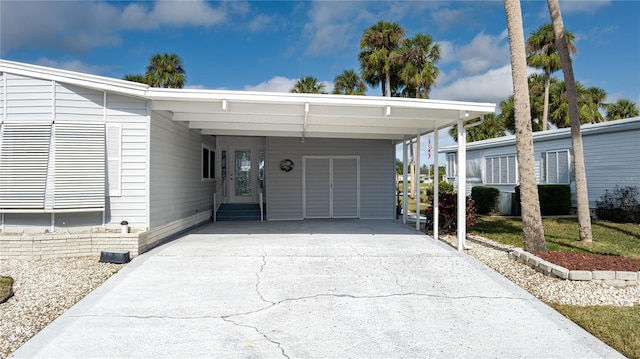 view of front of home with a carport