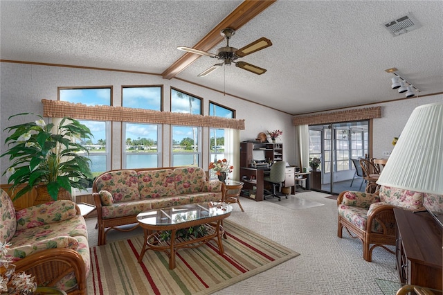 living room with vaulted ceiling with beams, light colored carpet, crown molding, a water view, and a textured ceiling