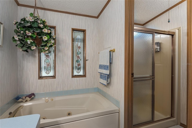 bathroom with ornamental molding, independent shower and bath, and a textured ceiling