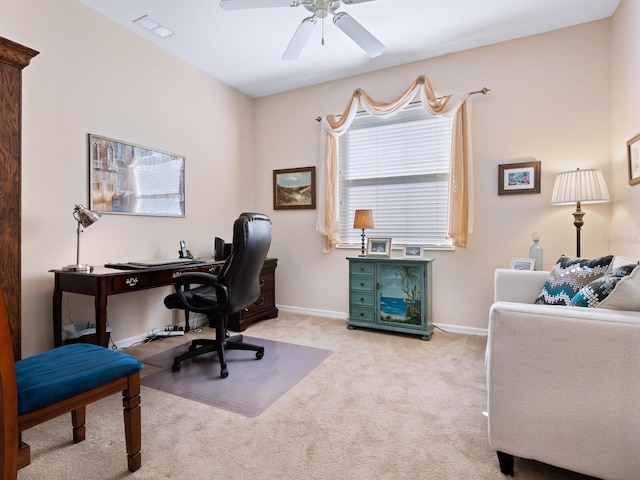 carpeted office space with visible vents, ceiling fan, and baseboards