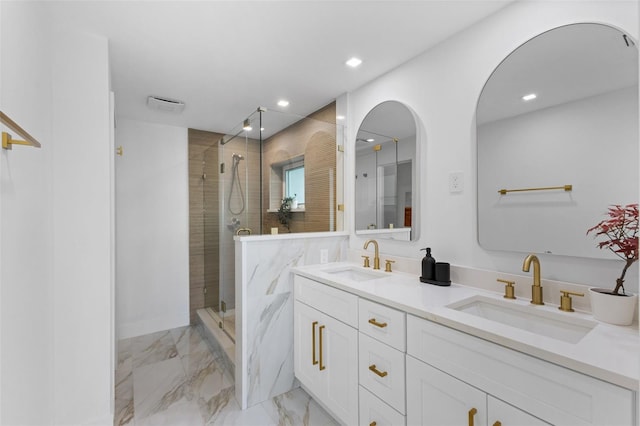 bathroom featuring vanity and a tile shower