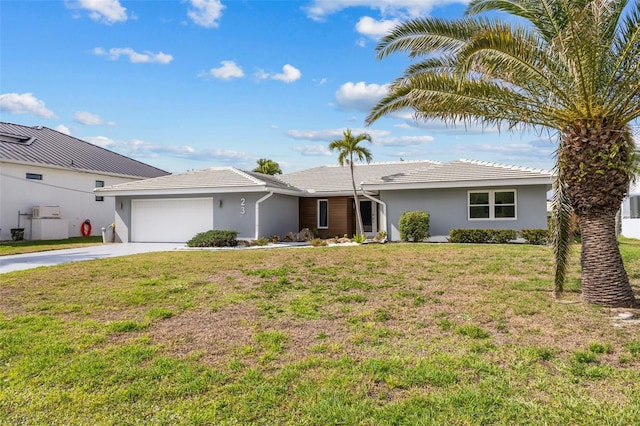 single story home with a garage and a front lawn