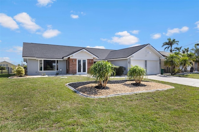 ranch-style house featuring a garage, a front lawn, and french doors