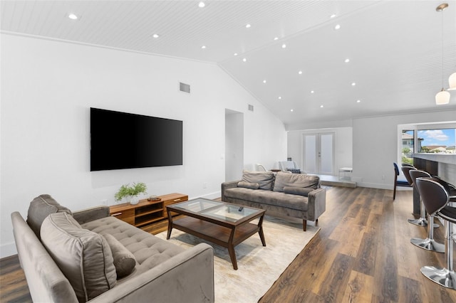 living room featuring vaulted ceiling and hardwood / wood-style floors