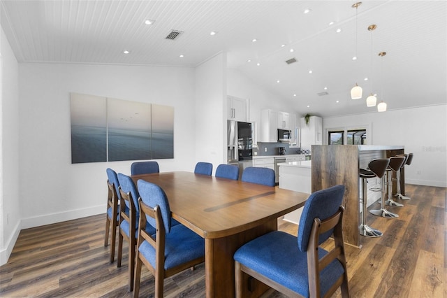 dining room featuring high vaulted ceiling and dark hardwood / wood-style flooring