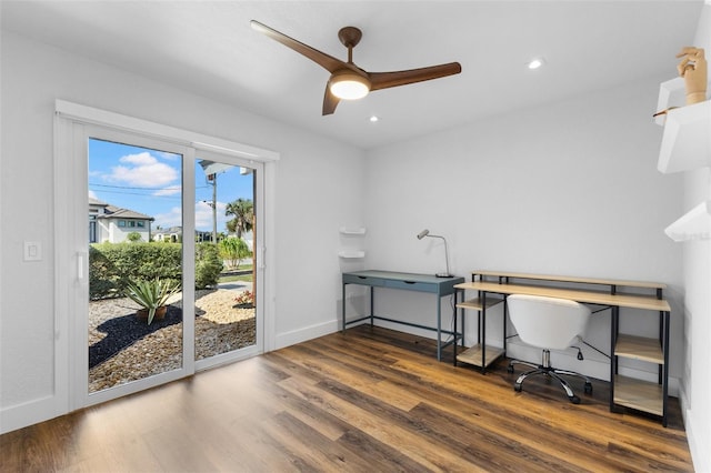 office with dark wood-type flooring and ceiling fan