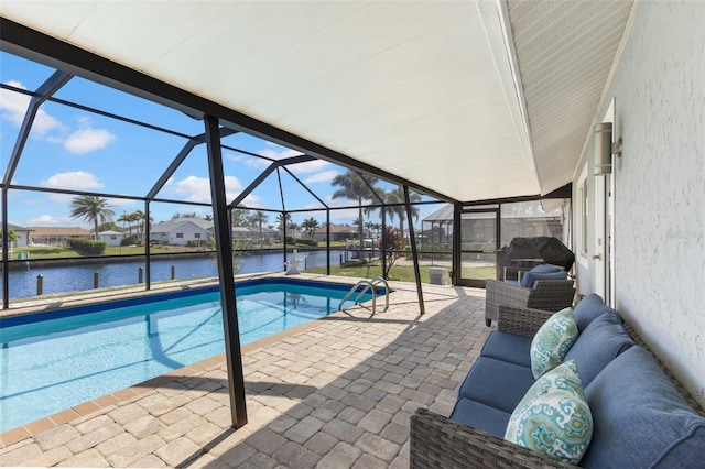 view of swimming pool featuring a water view, a patio, outdoor lounge area, and glass enclosure