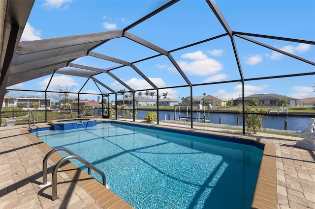 view of pool with a lanai, a patio area, a water view, and an in ground hot tub