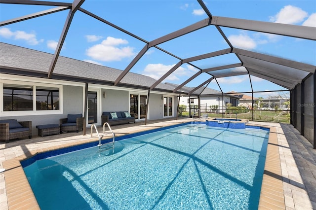 view of swimming pool with an in ground hot tub, an outdoor living space, a lanai, and a patio