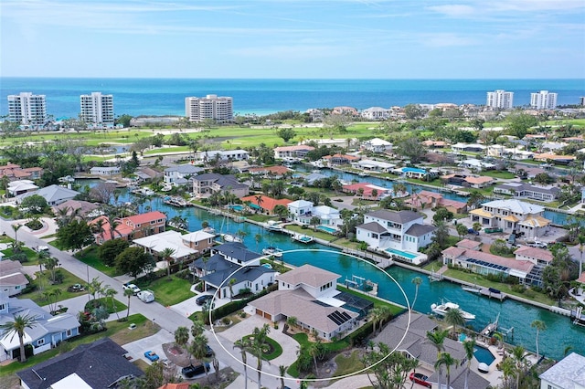 aerial view with a residential view and a water view