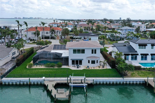 aerial view with a water view and a residential view