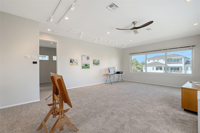 interior space featuring visible vents, light carpet, and baseboards