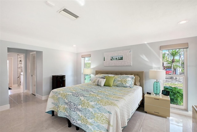 bedroom featuring recessed lighting, visible vents, baseboards, and light tile patterned floors