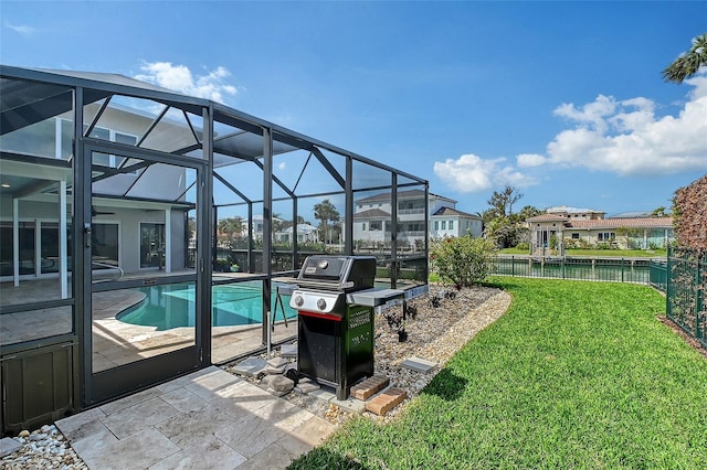 outdoor pool featuring a fenced backyard, a lanai, a lawn, grilling area, and a patio area