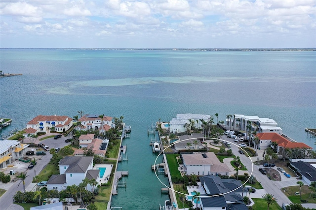 drone / aerial view with a water view and a residential view