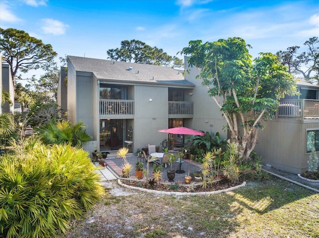 rear view of property featuring a patio