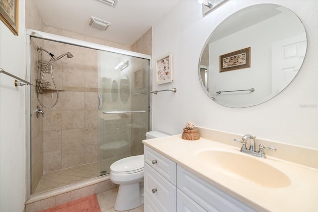 bathroom with vanity, an enclosed shower, tile patterned floors, and toilet