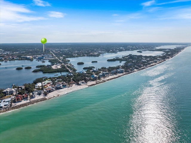 bird's eye view featuring a water view and a view of the beach