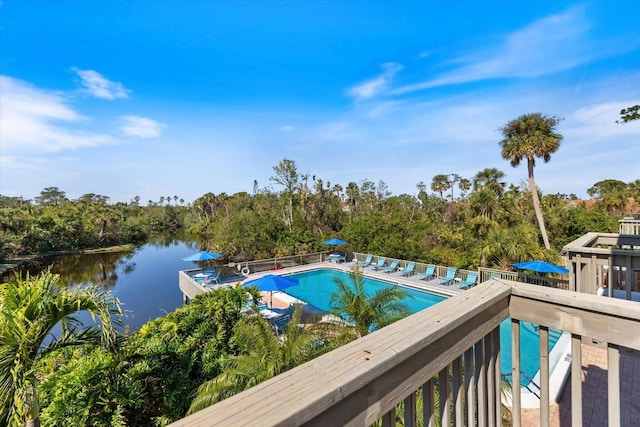 view of pool featuring a water view