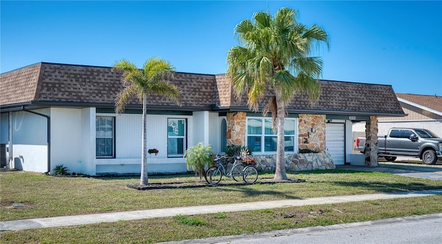 ranch-style house featuring a front lawn