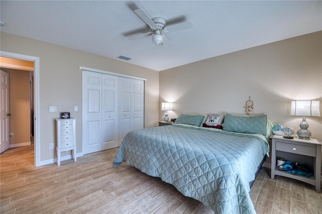 bedroom with a closet and ceiling fan