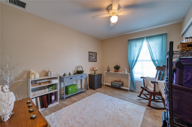 interior space with light hardwood / wood-style flooring and ceiling fan