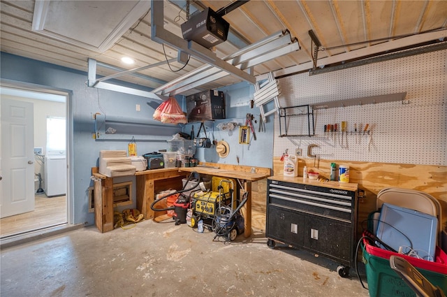 kitchen featuring washer / dryer and concrete floors