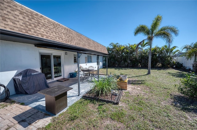 view of yard with a fire pit and a patio