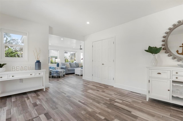 interior space with recessed lighting, baseboards, and light wood-style flooring