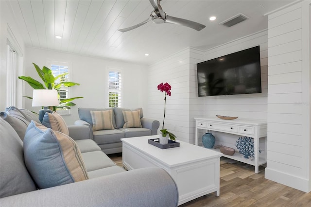 living room featuring ceiling fan, wooden ceiling, and light wood-type flooring