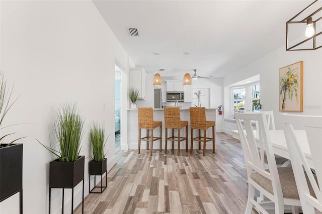 dining area featuring light hardwood / wood-style flooring