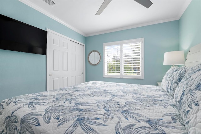 bedroom featuring ceiling fan, a closet, and ornamental molding