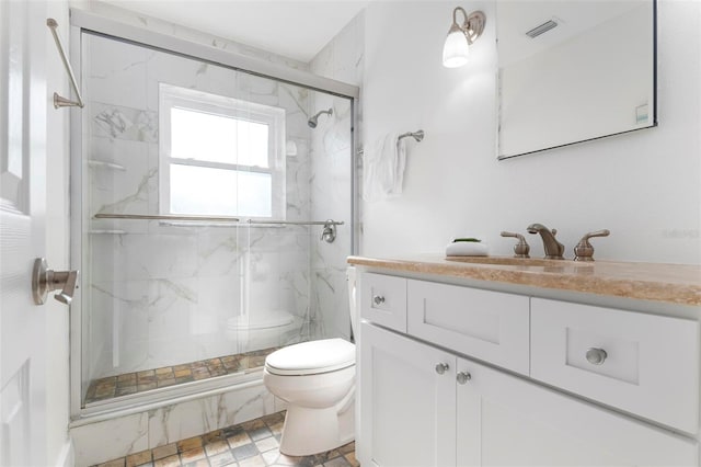 full bathroom featuring a marble finish shower, visible vents, toilet, and vanity