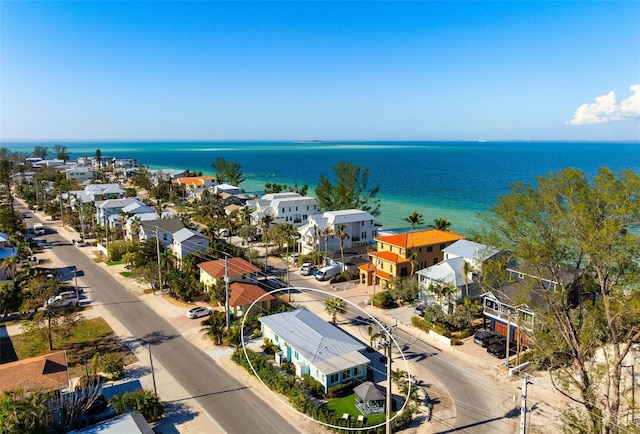 birds eye view of property with a residential view and a water view