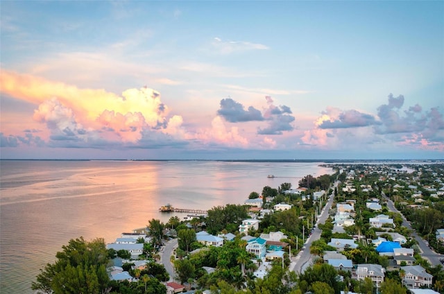 aerial view at dusk with a water view