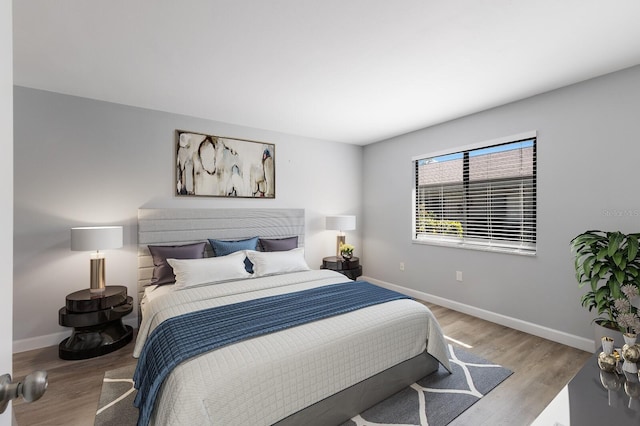 bedroom with light hardwood / wood-style floors