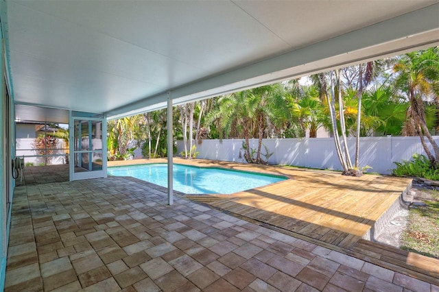 view of swimming pool featuring a fenced in pool, a patio area, and a fenced backyard