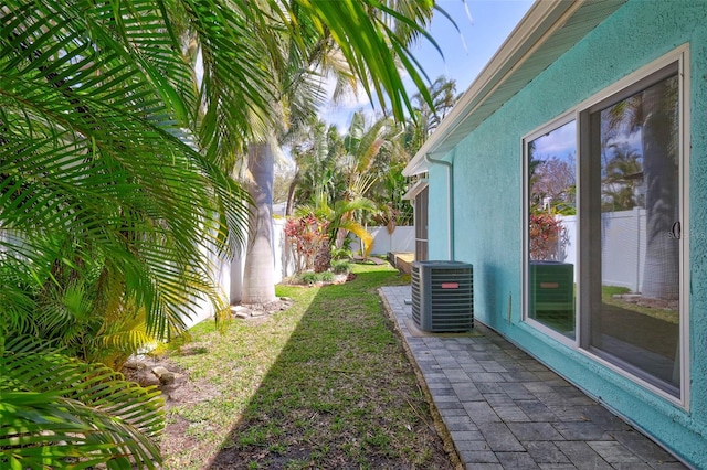 view of yard featuring cooling unit and a fenced backyard